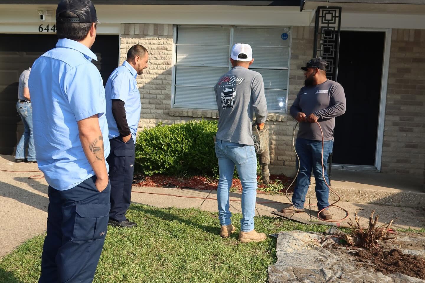 Staggs Plumbing crew on-site assessing a plumbing issue before providing a flat-rate quote