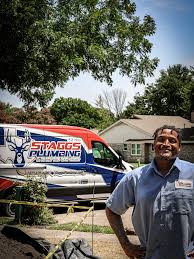 Staggs Plumbing technician completing a plumbing repair on the first visit